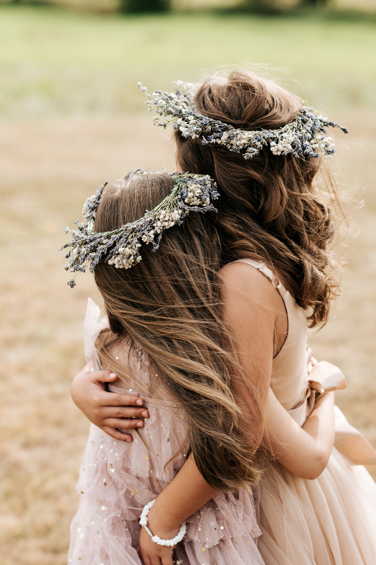Flower girls wearing lavender hair crowns