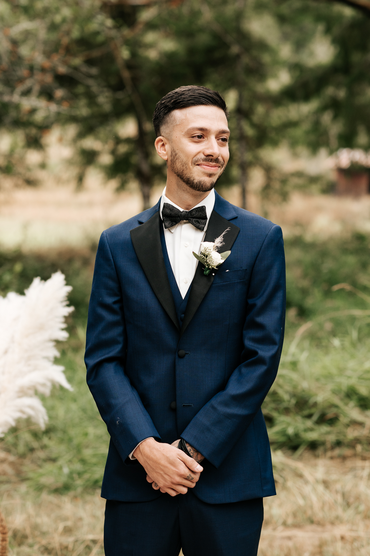 Groom sees his bride for the first time when she is walking down the aisle