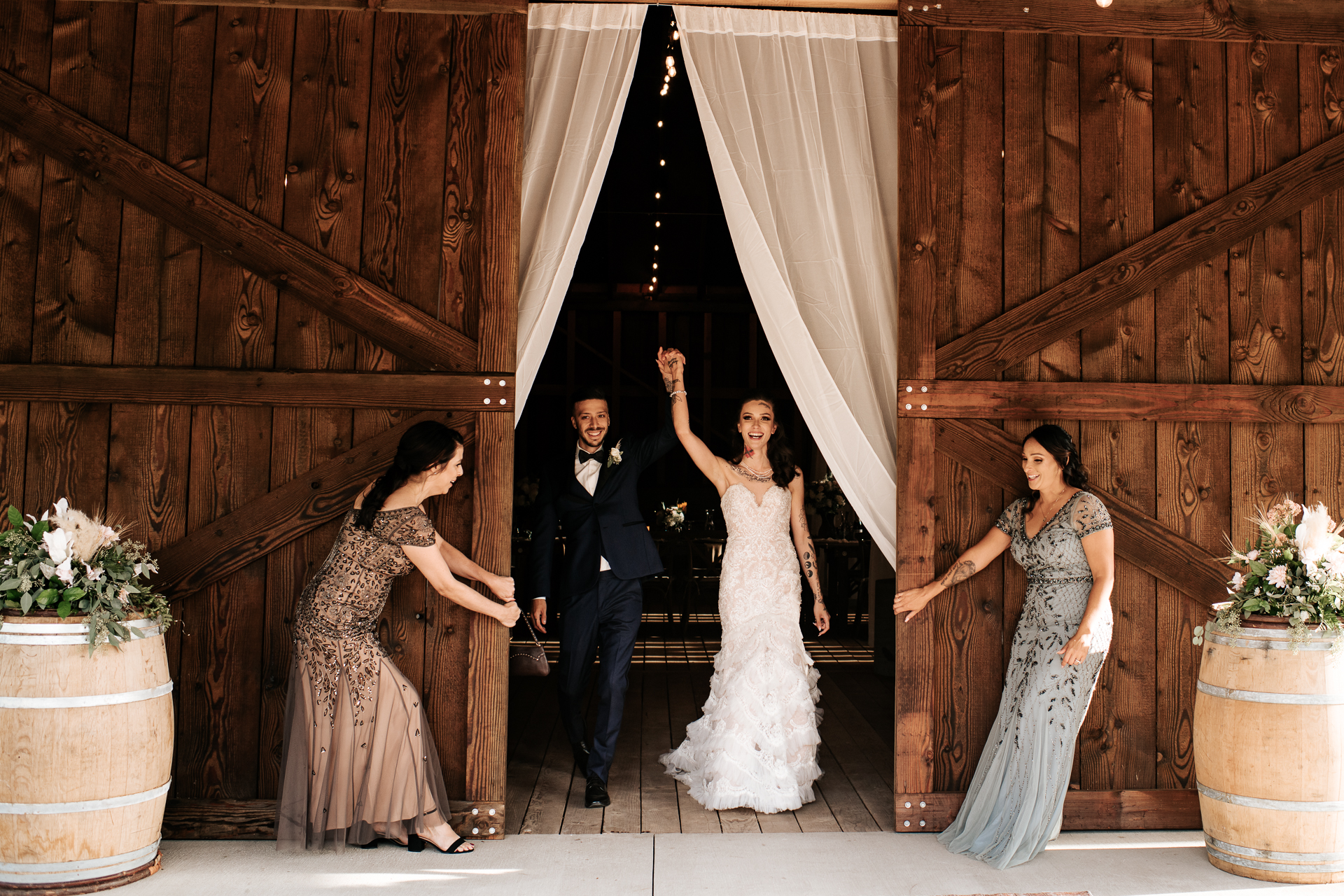 Bride and Groom get announced through barn doors at their wedding reception