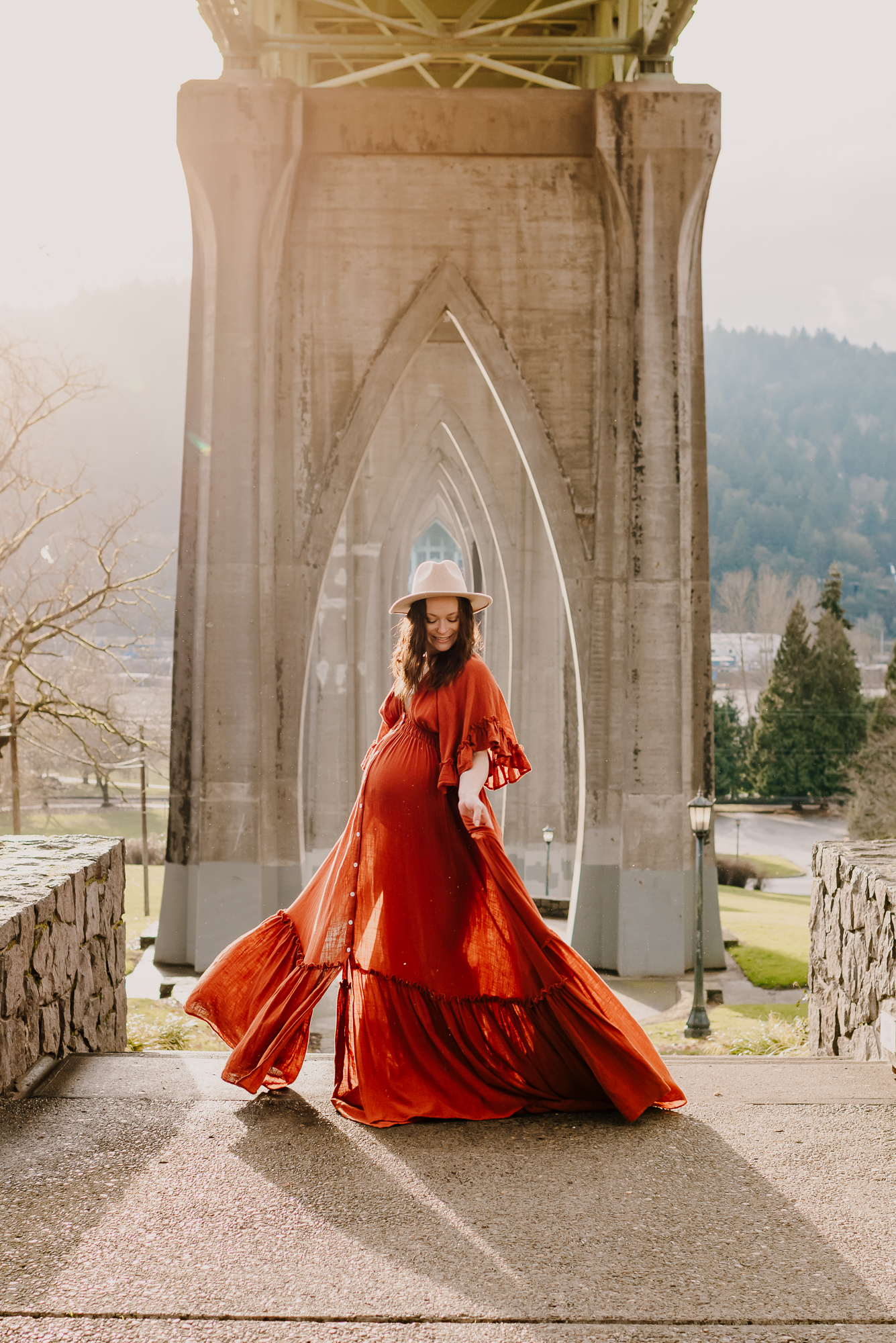 Expecting mother twirling in maternity dress